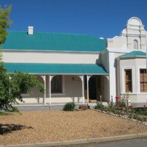 Ladismith Manor: a white building with a green roof