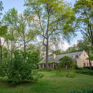 Languedoc: an old white house with trees in the yard
