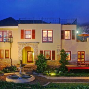 Lavender Manor Guest Lodge: a large house with a fountain in front of it