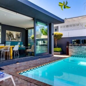 Life & Leisure Boutique Guesthouse: a swimming pool in the backyard of a home with a house