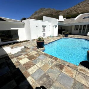 Links Crescent Cottages Coastal Family Retreat: a swimming pool in the backyard of a house
