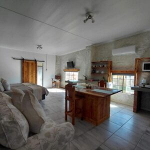 LuFan Studio-Greeff Cottages: a living room with a couch and a table