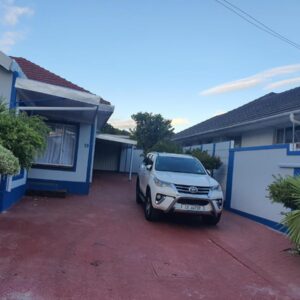 Mabel Guesthouse: a car parked in front of a house