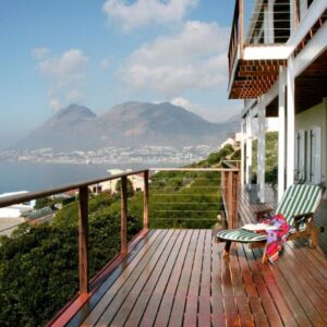 Moonglow Guesthouse: a balcony of a house with a view of the ocean