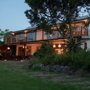 Moonshine on Whiskey Creek: a large house with a lot of windows