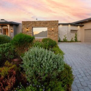 Nuach Luxury Suites: a house with a brick driveway in front of it