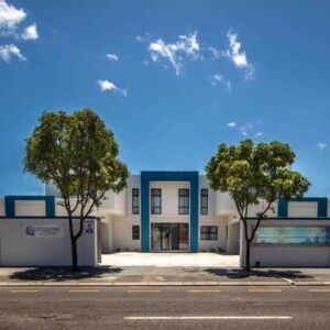 Oceanway Boutique Hotel/Conference: a building with two trees in front of it