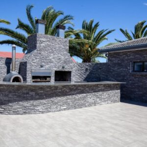 Olivara Kloof Accommodation: a brick house with palm trees in the background