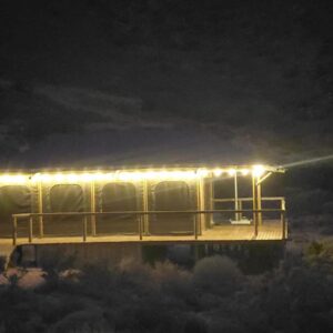 Oudemuur Glamping: a house with lights on top of it at night
