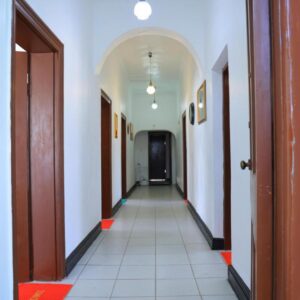 paradise guest house: an empty corridor in a building with a hallway