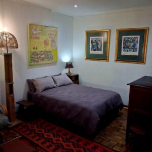 Pennywhistle: a bedroom with a bed and a chair