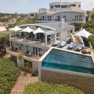Periwinkle Lodge Guest House: an aerial view of a house with a swimming pool
