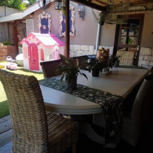 Phala Guesthouse: a table with a gingerbread house on top of it