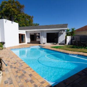 Phoenix Haven: a swimming pool in the backyard of a house