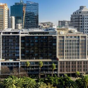 Radisson Hotel Cape Town Foreshore: a city skyline with tall buildings and palm trees
