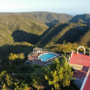 Rainforest Ridge Eco Resort: an aerial view of a house in the mountains