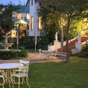 Riebeek Valley Hotel: a table and chairs in the yard of a house