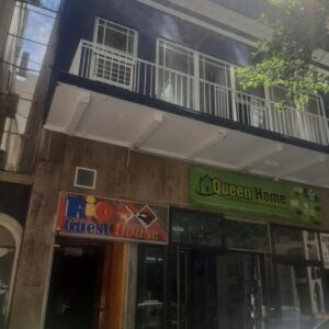 Rio Guest House: a building with a balcony on top of it