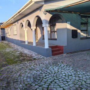 Safespace: a building with a cobblestone street in front of it