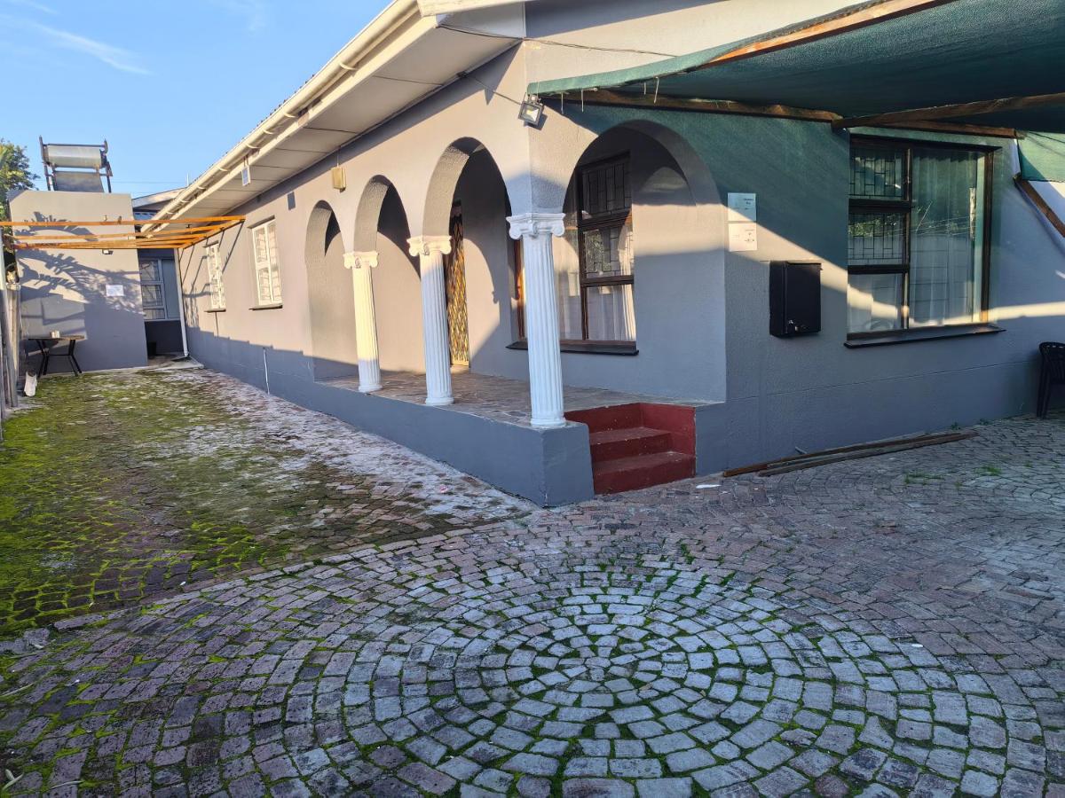Safespace: a building with a cobblestone street in front of it