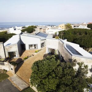 Salt Shore Studios: an aerial view of a house with solar panels