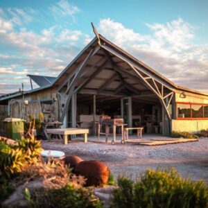 Sea Shack: a house with a wooden roof with a patio