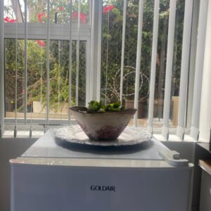 Seaview Sunset Boutique Apartments Gordonsbay Solar powered: a bowl on a counter in front of a window