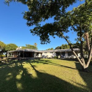 Somer House Guest Suites: a house with a tree in front of a yard