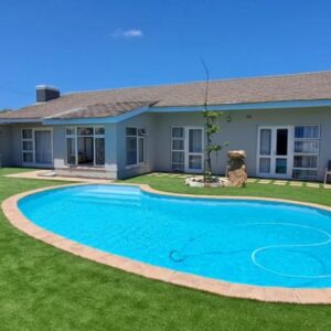 Southern Suburbs Stays: a swimming pool in the yard of a house