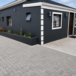 Springforth Guesthouse: a blue building with a brick driveway