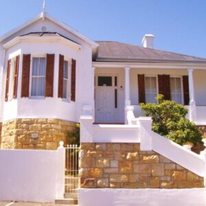 Stonehurst Guest House: a house with a white fence in front of it