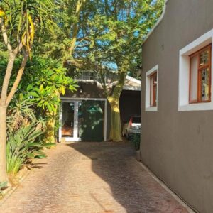 Suites on 74: a house with a walkway leading to a doorway