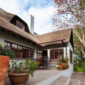 Summerhill Guest Farm: an outside view of a house with a wooden deck