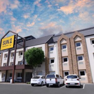 SUN1 Foreshore Cape Town: a large building with cars parked in a parking lot