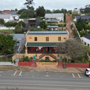 Suntouched Inn: a building on the side of a city street