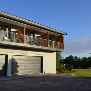 Swanemeer Apartments: a house with a balcony and a garage