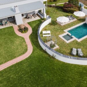 Sweetwater Guesthouse: an aerial view of a house with a swimming pool