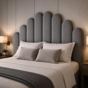the beach house table view guesthouse: a large bed with a padded headboard in a bedroom