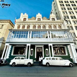 The Cape Town Club: two white cars parked in front of a building