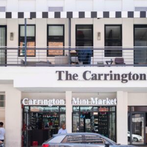 The Carrington Aparthotel by Totalstay: a building with a car parked in front of it