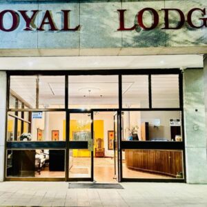 The Royal Lodge: a building with a revolving door in front of it