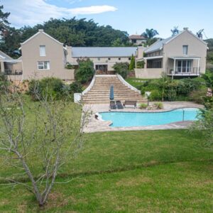 The Suites at Waterryk Eco Guest Farm: a house with a swimming pool in a yard