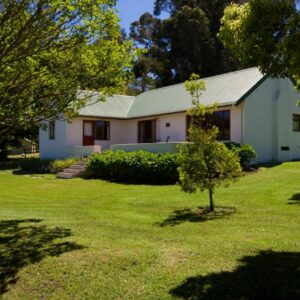 The Volmoed Trust: a white house with trees in the yard