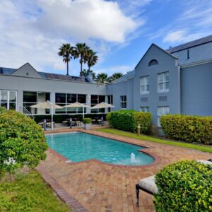 Town Lodge Bellville: an exterior view of a building with a swimming pool