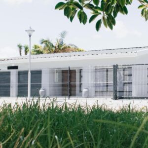 Tranquil Private Rooms Hermanus: a white house with a fence in front of it