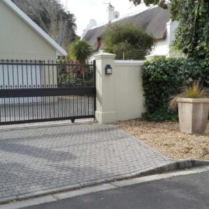 Tranquil Tokai: a white fence with a gate in front of a house
