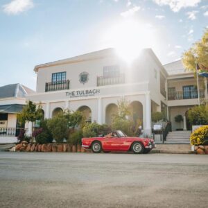 Tulbagh Boutique Heritage Hotel: a red car parked in front of a white building