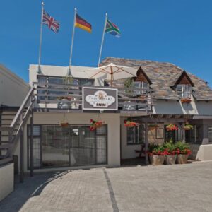 TwentyFour 17 Inn: a building with two flags on top of it