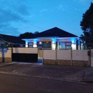 UFC guest house: a house with blue lights in front of it