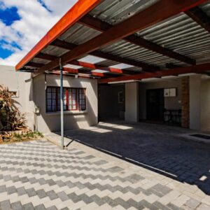 Urban Oaks: a patio with awning on the side of a building